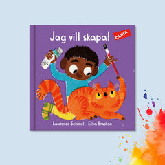 Omslag till pekboken Jag vill skapa! Ett barn med brun hudfärg leker med en orange katt, färgtub och pensel.