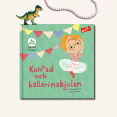 Omslaget till Konrad och ballerinakjolen  - en pojke med kjol, halsband och hårspännen.