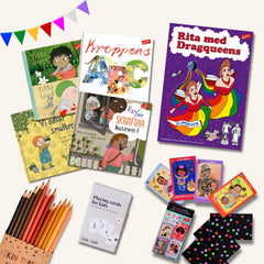4 bilderböcker, en målarbok, ett paket färgpennor & 2 kortspel på vit yta. I hörnet syns färgglada vimpelgirlanger