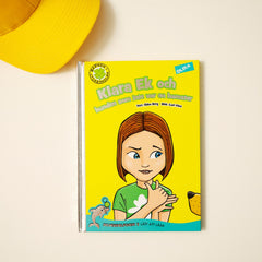 Lätt att läsa boken Klara Ek & hunden som inte var en hamster syns på vit yta med en gul keps