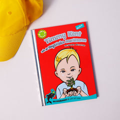 Lätt att läsa boken Timmy Kent & de mystiska morötterna syns på vit yta tillsammans med en gul keps